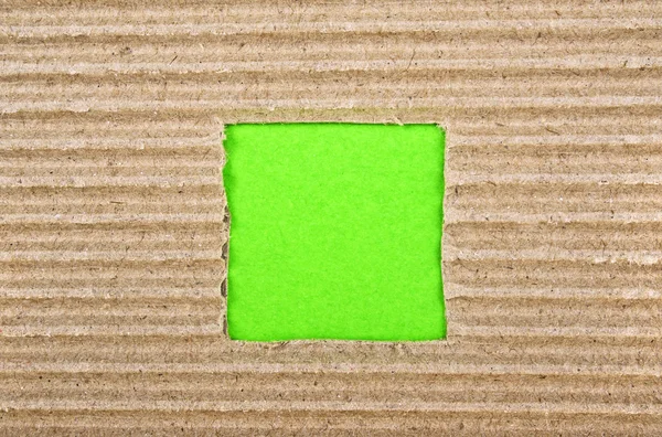 Τετράγωνη τρύπα με πράσινο χαρτί, το χαρτόνι — Φωτογραφία Αρχείου