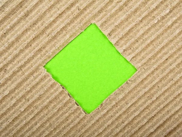 Τετράγωνη τρύπα με πράσινο χαρτί, το χαρτόνι — Φωτογραφία Αρχείου