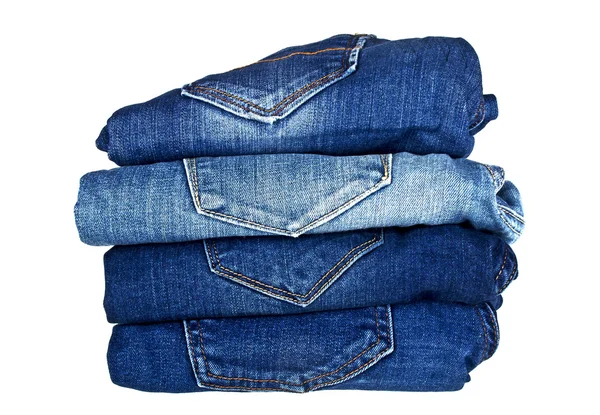 Massa olika Blå jeans isolerad på vit bakgrund — Stockfoto