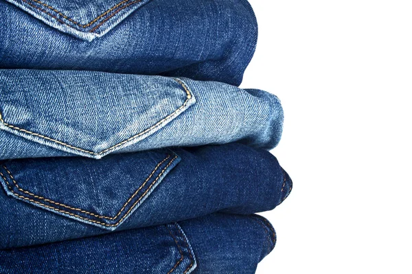 Sok különböző blue Jeans elszigetelt fehér background — Stock Fotó