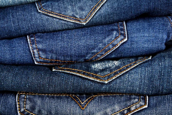 Stack olika Blå jeans. Jeans bakgrund. — Stockfoto