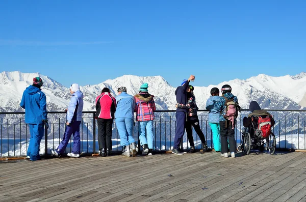 Sochi, Russia, February, 29, 2016, Ski resort Rosa Khutor. People look for the mountains from the observation deck of Rosa peak — Stock Photo, Image