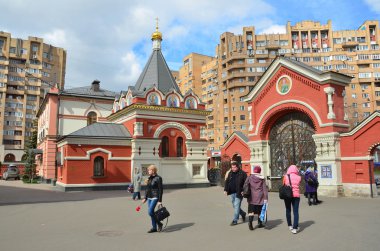 Moscow, Russia, April, 21, 2016, People walking in Pokrovsky Stavropigialny women's monastery near Pokrovskaya Zastava in Moscow clipart