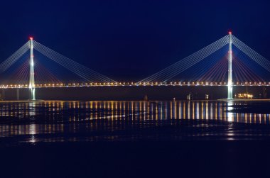 Cable-stayed bridge to island Russian in winter night. Vladivostok, Primorsky Krai, Russia