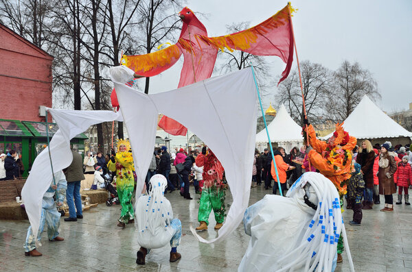 Moscow, Russia, February, 22,2015, Russian scene: People celebrating Maslenitsa holiday in the garden "Hermitage". Scene: Summer banishes the winter