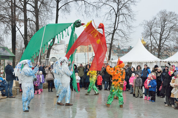 Moscow, Russia, February, 22,2015, Russian scene: People celebrating Maslenitsa holiday in the garden "Hermitage". Scene: Summer banishes the winter