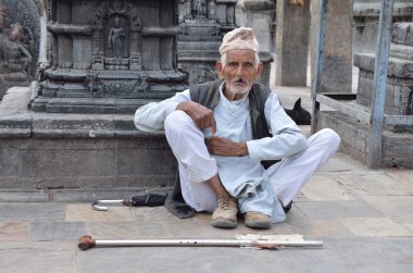 Kathmandu, Nepal, September, 29, 2013, Nepali  Scene: elderly man begging in the temple complex of Swayambhunath