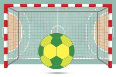 Kalenin önünde hentbol topu ve arka planda mahkeme manzarası.