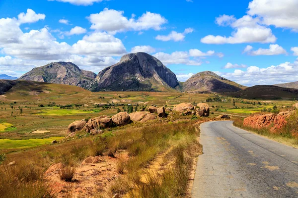 Landscape with road and rock formation in central Madagascar — Stock Photo, Image