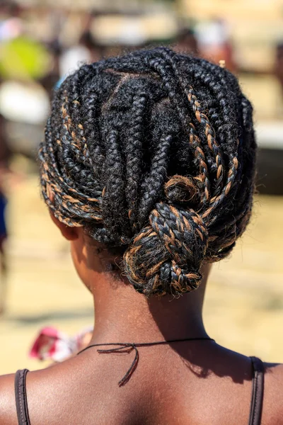 Young african woman with dreadlocks in her hair seen from behind — Stock Photo, Image