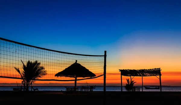 Sunset over the ocean at a resort — Stock Photo, Image