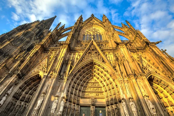 Facade of the Dom church in the city Cologne lit by sun — Stock Photo, Image