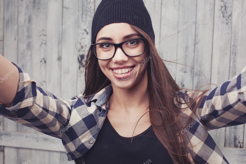 Hipster Glasses - Hipster girl in glasses and braces Stock Photo by Â©doodko 66405395