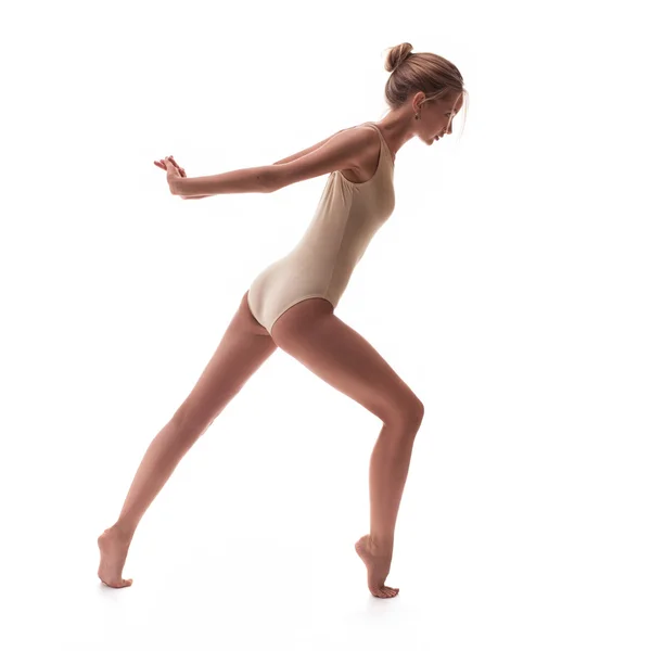 Young beautiful dancer in beige swimsuit — Stock Photo, Image