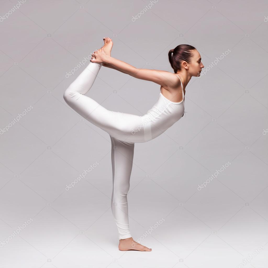 Young beautiful woman yoga posing. isolated Stock Photo by ©doodko 89399074