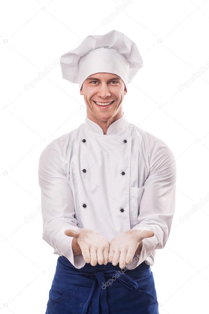 Portrait of smiling chief cook with hand sign Stock Photo by ©doodko