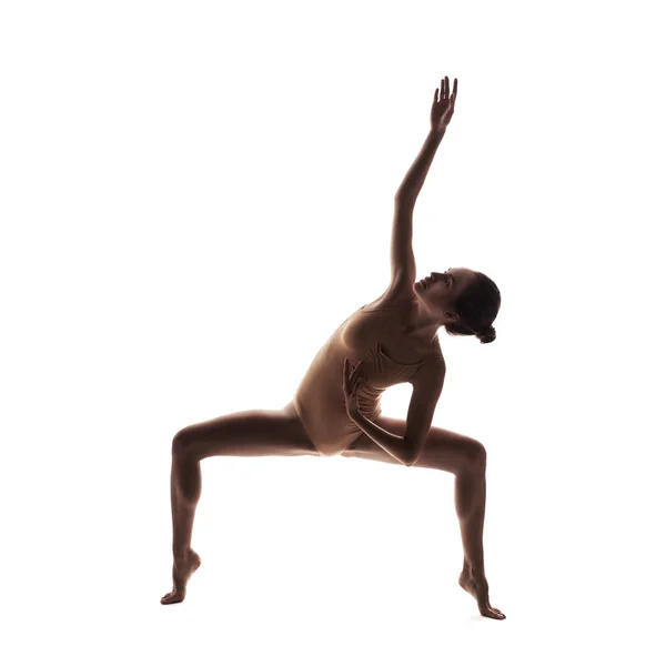 Young beautiful dancer in beige swimsuit posing — Stock Photo, Image