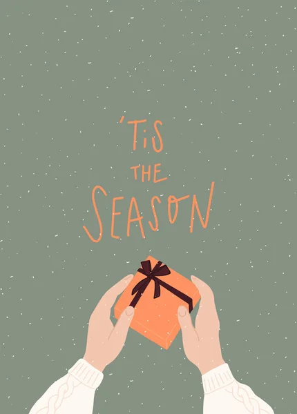 Vector hand drawn Christmas postcard with quote : tis the season. Hands holding a gift box with ribbon — Stock Vector