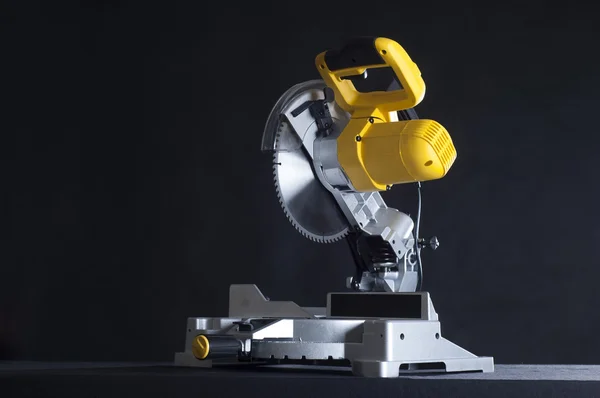 Miter saw on a black background — Stock Photo, Image