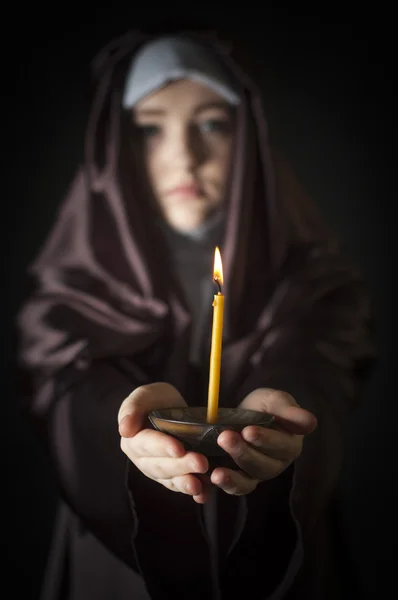 Nun with candle. — Stock Photo, Image