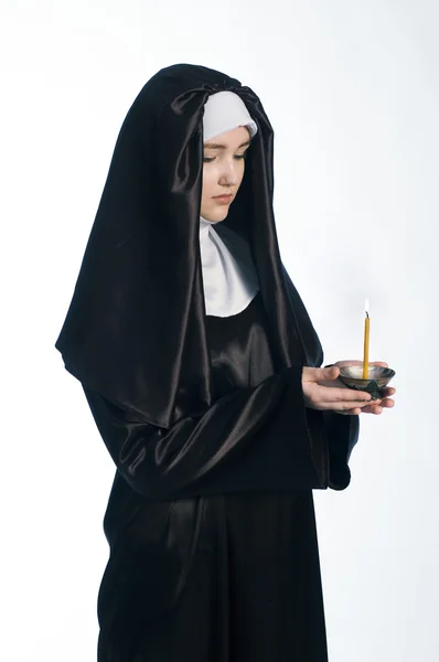 Nun with candle. — Stock Photo, Image