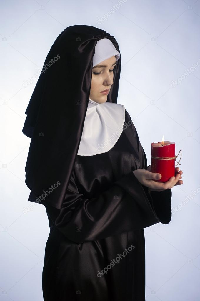 Nun with candle. 