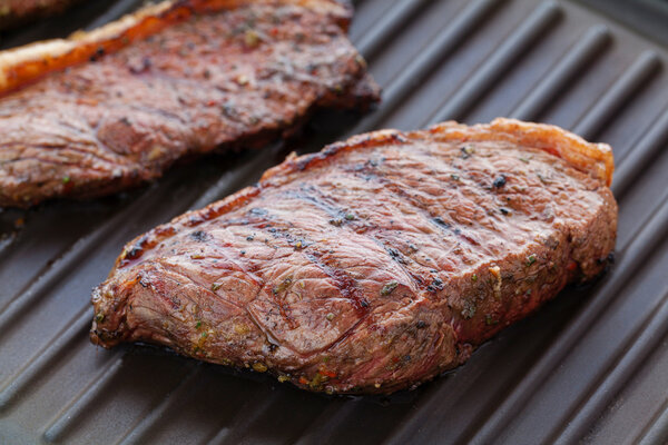 Picanha steaks on grill, traditional brazilian barbeque