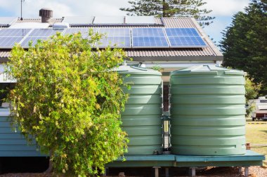 Water tank and solar panels clipart