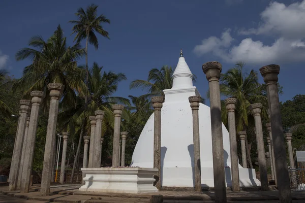 A big white stupa / pagoda surrounded by pillars, in Mihintale, Sri Lanka - Asia — Stock Photo, Image
