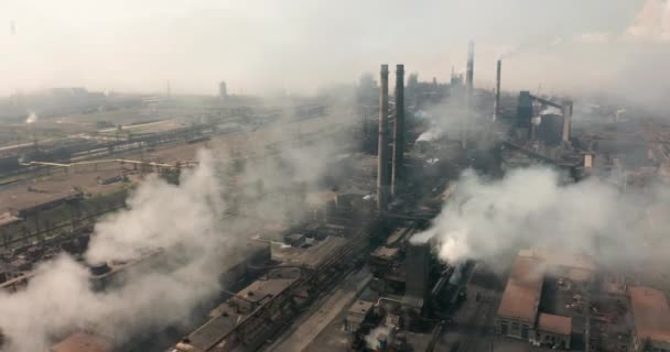 Aerial view. Emission to atmosphere from industrial pipes. Smokestack pipes shooted with drone. — Stock Video