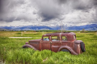 Rusting Jalopy On Montana Farm clipart
