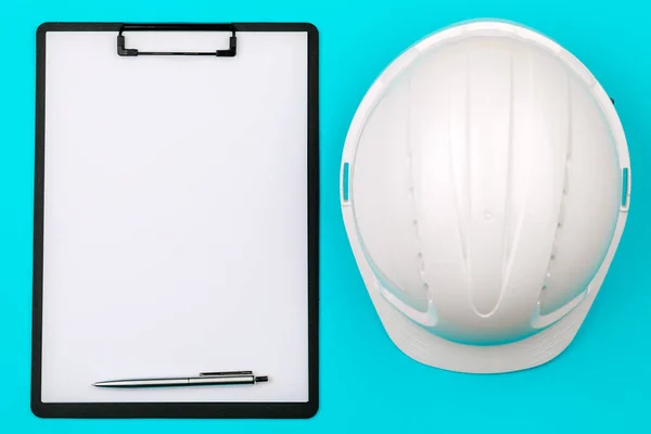 Top View White Safety Engineer Helmet Empty Notepad Blue Background — Stock Photo, Image