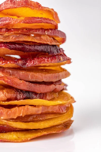 slices of dried plum on a white background. dried fruits. eco. macro. delicacy.