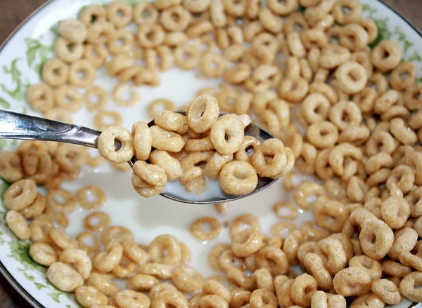 Bowl of breakfast cereal with milk and spoon — Stock Photo, Image