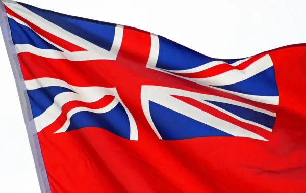 Union Jack bandeira acenando orgulhosamente na brisa — Fotografia de Stock