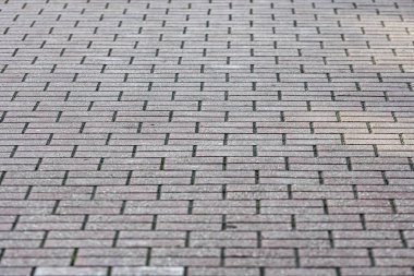 perspektif görünümü monoton gri tuğla kaldırım, model için doku arka planı