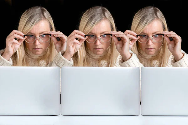 cloned image, three identical, emotional middle-aged women surprised staring at a computer screen, copy space, concept for creative poster