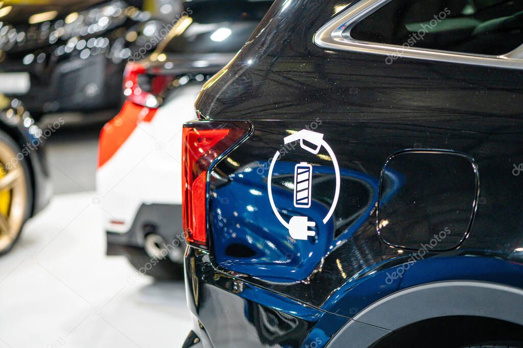 Eco electric car sign on the car, emission-free vehicle designation, closeup