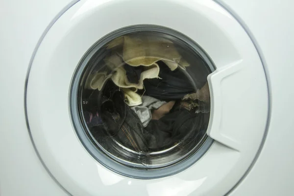 Close up front view of a washing machine door in operation — Stock Photo, Image