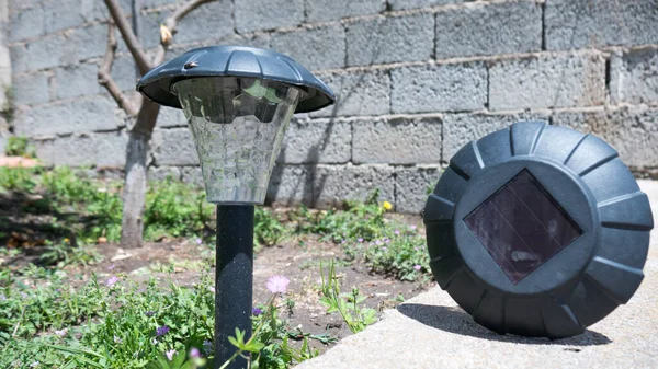 Close up of solar garden lights with the solar panel in a garden garden Stock Photo