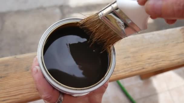 Hand of wood professional painting with impregnating agent, for wood a brown — Stock Video