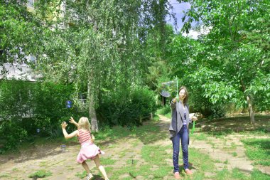 children playing with blowing bubbles in the park