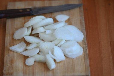 Chopped onion on a wooden board,