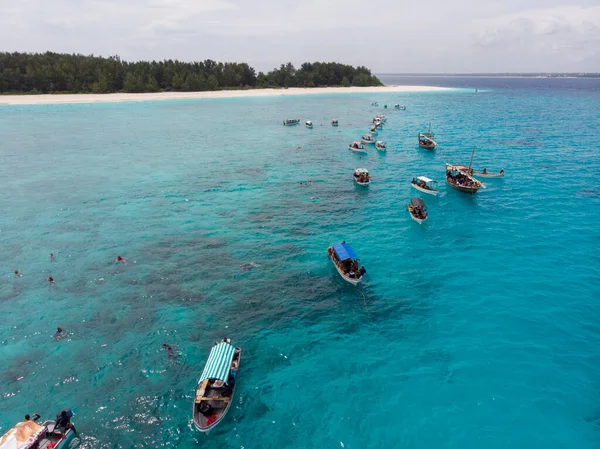 Aerial view of Boats Staying near Mnemba Atoll in Zanzibar - The Famous Spot for Snorkeling and Boat Tour