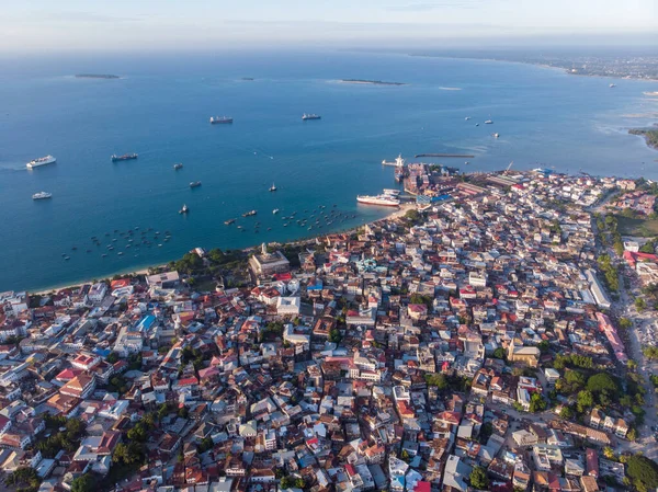 Very High Above Aerial Top View Shot of Stone Town, the Capital of Zanzibar, Tanzania. Sunset Time Coastal City in Africa