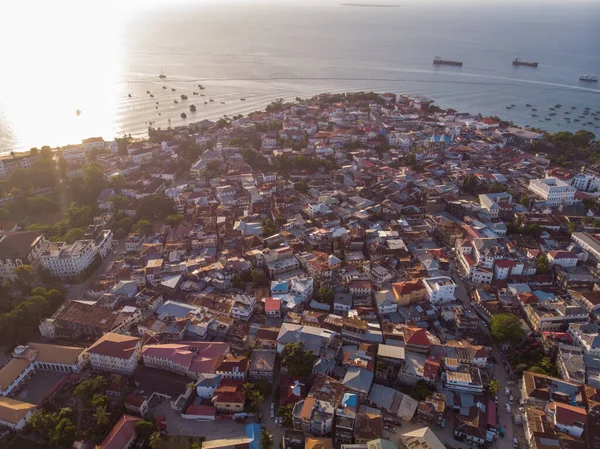 Very High Above Aerial Top View Shot of Stone Town, the Capital of Zanzibar, Tanzania. Sunset Time Coastal City in Africa