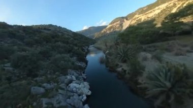 FPV Drone Cinematic Shot aerial waves and sandy beach at sunset time Near the Fisherman House on Lykian Way at the Demre beach. Extreve Aerobatics by Racing Drone.