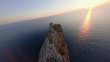 Aerial Cinematic FPV Drone Shot Flyby on the Alanya Cape at Sunset Time. Beautiful Alanya Castle Footage Made on Racing Drone Aerobatics Extreme