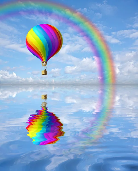 Colorful hot air ballon in the blue sky with rainbow — Stock Photo, Image