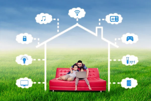 Happy family with smart house technology system — Stock Photo, Image